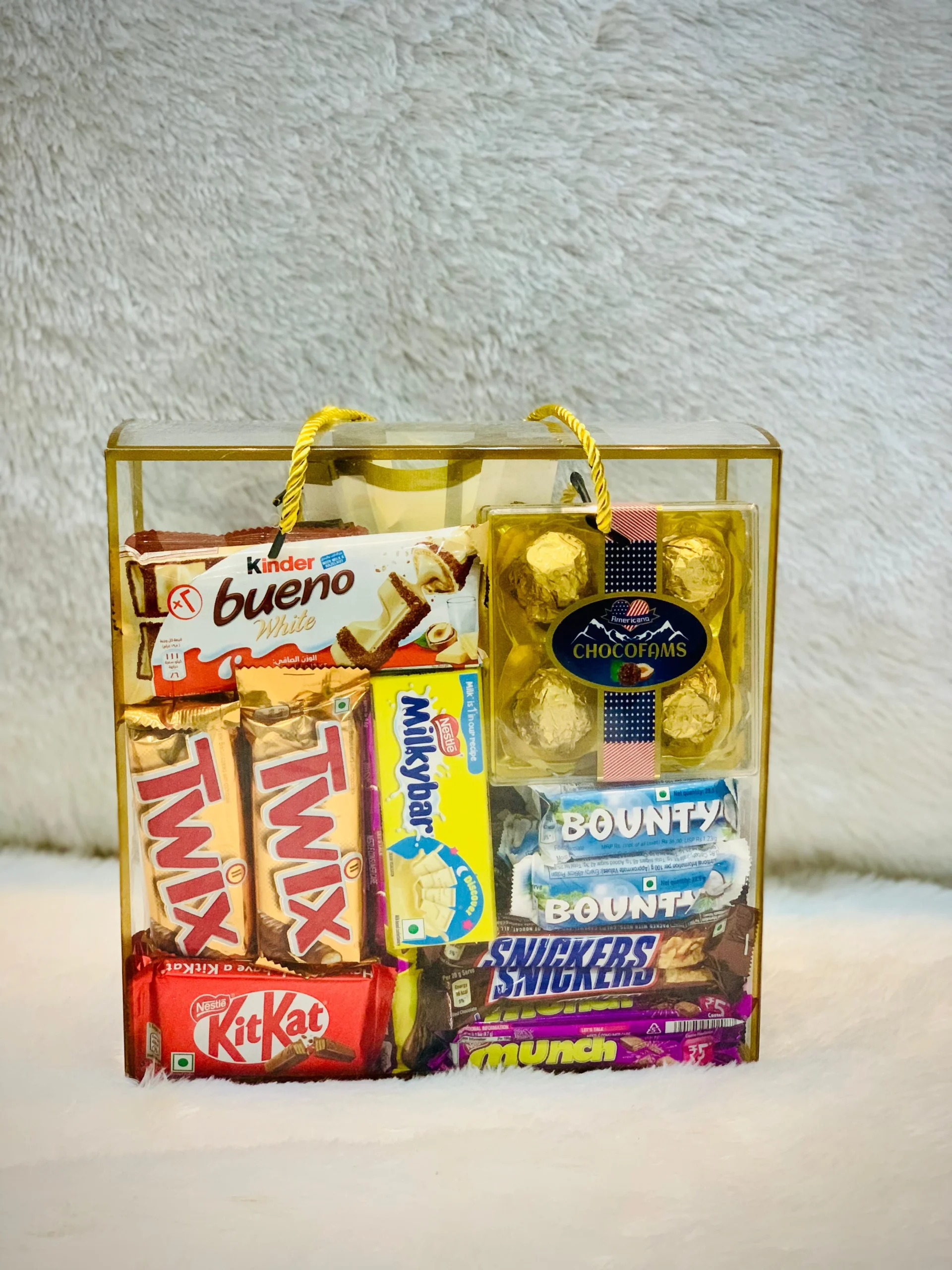 . A small bag filled with assorted chocolates and colorful candies, showcasing a variety of sweet treats.